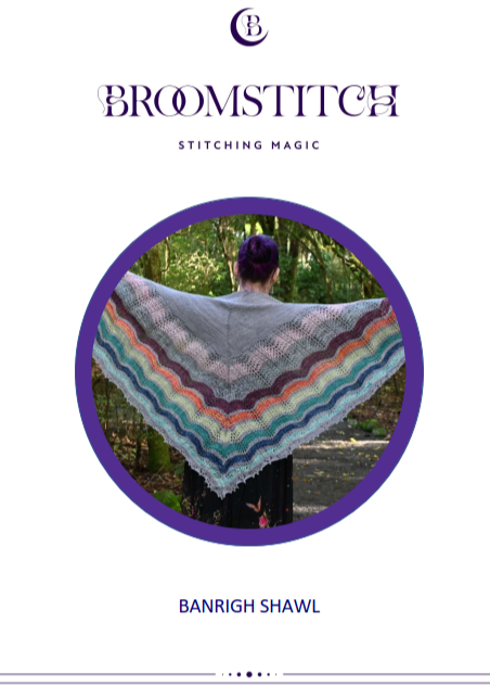 Broomstitch shawl with a person wearing it outdoors, showing the stripes